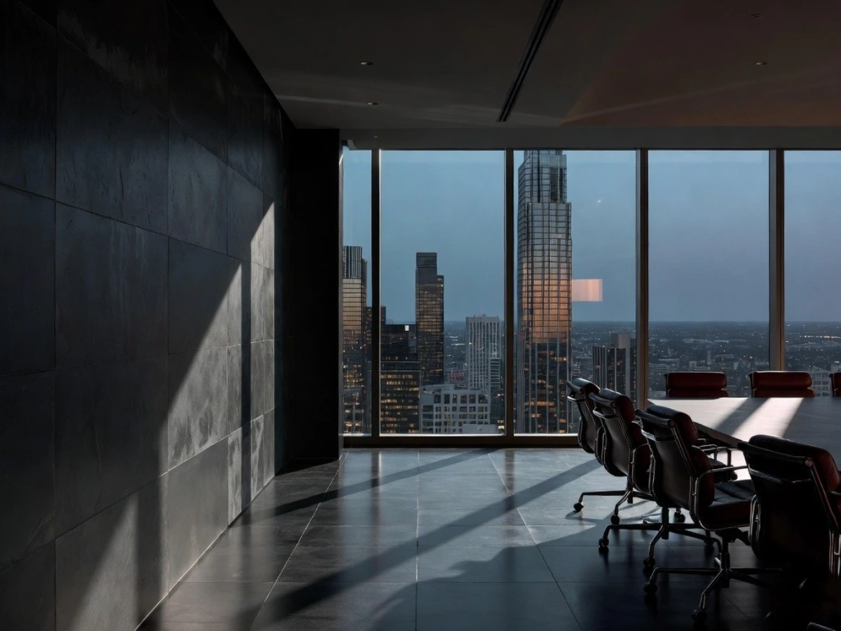 Executive boardroom at akd STUDIO featuring dark slate architecture and burgundy leather chairs, representing our enterprise-level digital marketing and IT infrastructure leadership.